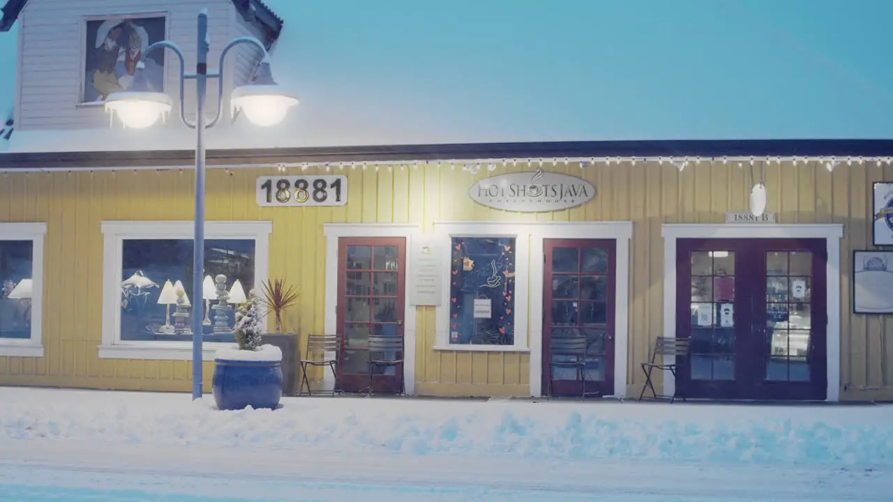 Early morning in Poulsbo Washington with a rare snowfall a view of a downtown bakery