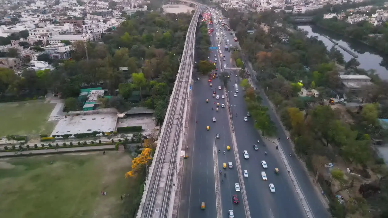 4K Drone Shots of a Sunset in an Indian City New Delhi above trees and houses beautiful light punjabi bagh club posh colony Metro train