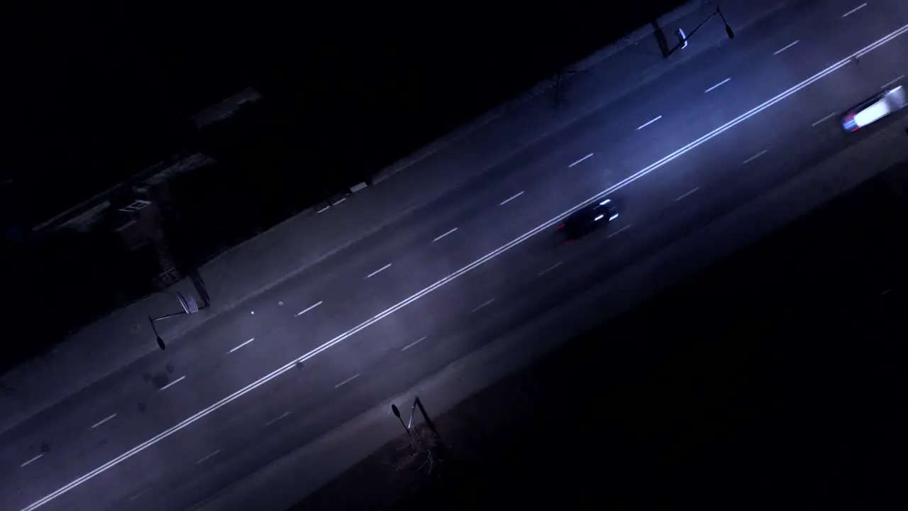 Aerial shot of the cars on the road at night