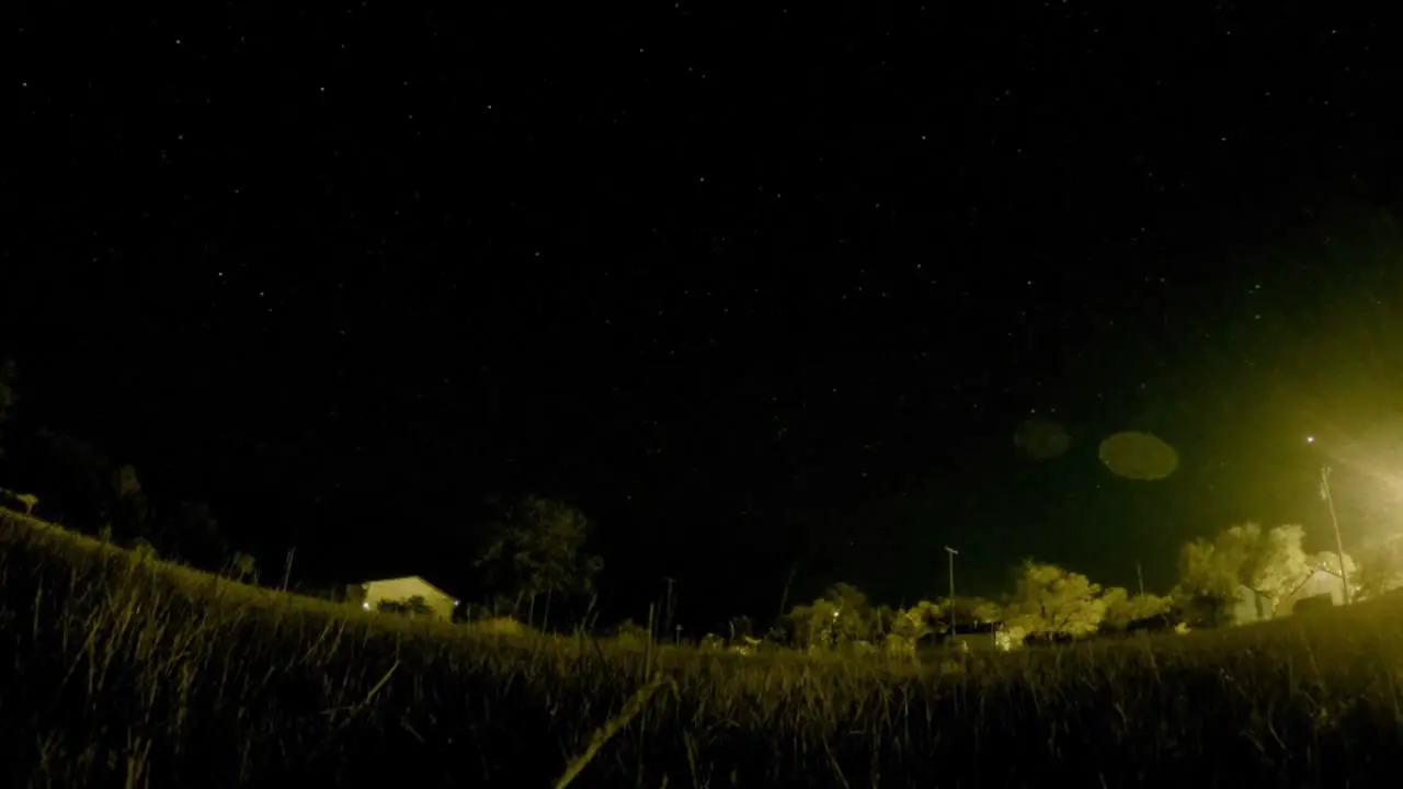 NIGHT LAPSE Stars in the sky over a field in the middle of the night in a small town in Empress Alberta Canada