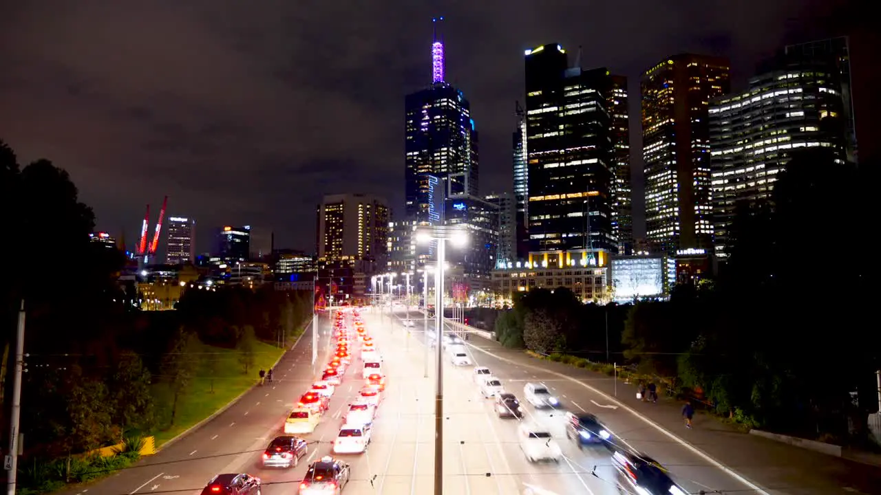 Melbourne traffic nighttime timelapse at motorway and railway