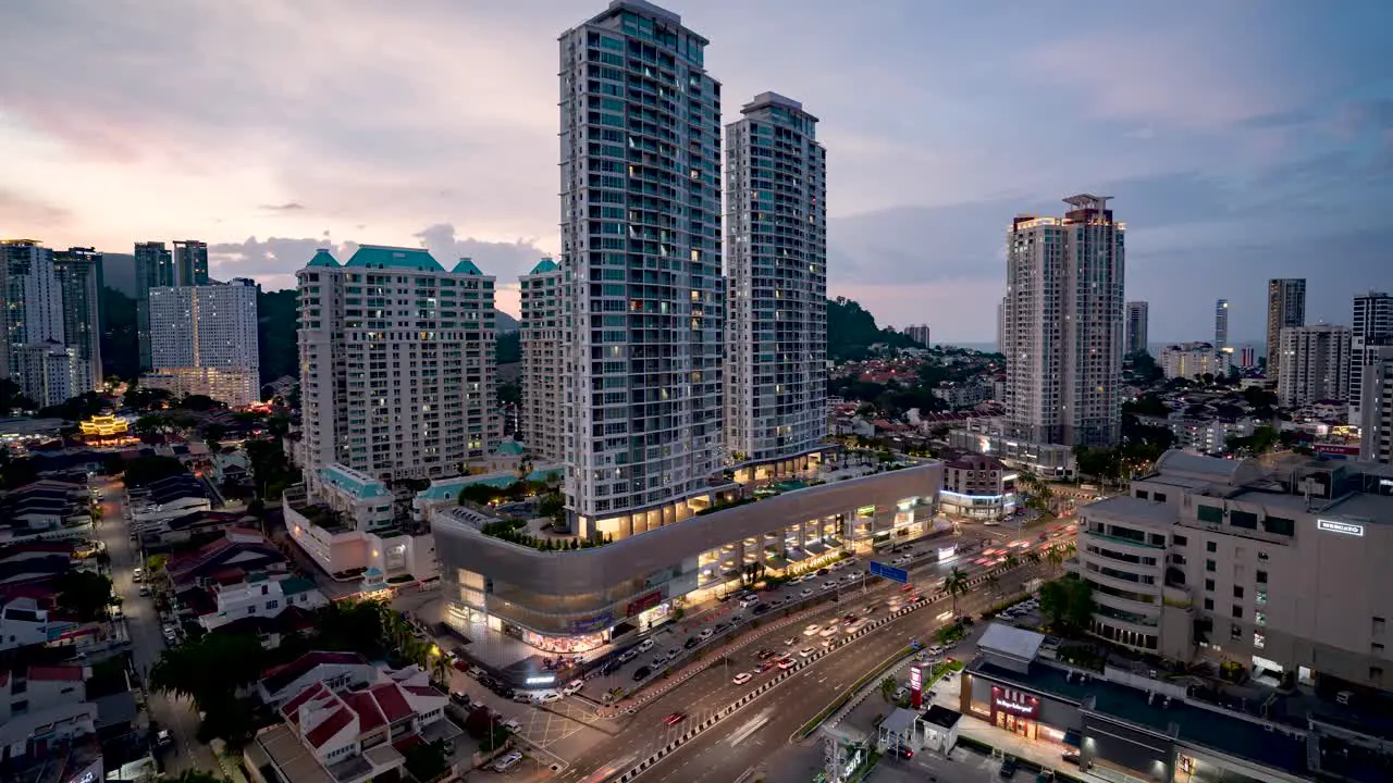 Day to night Time-Lapse of a Vibrant traffic Intersection in Penang Malaysia