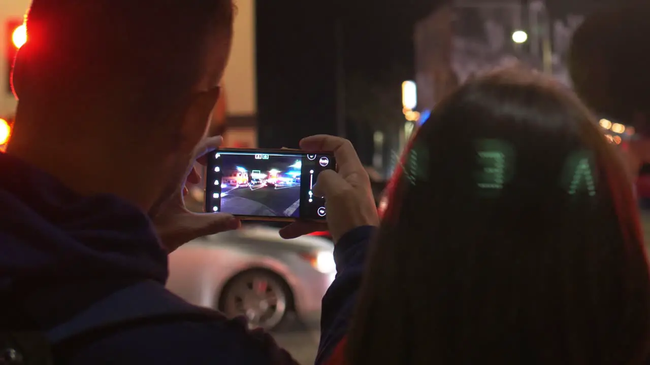 Photographing Venice Sign on Smartphone