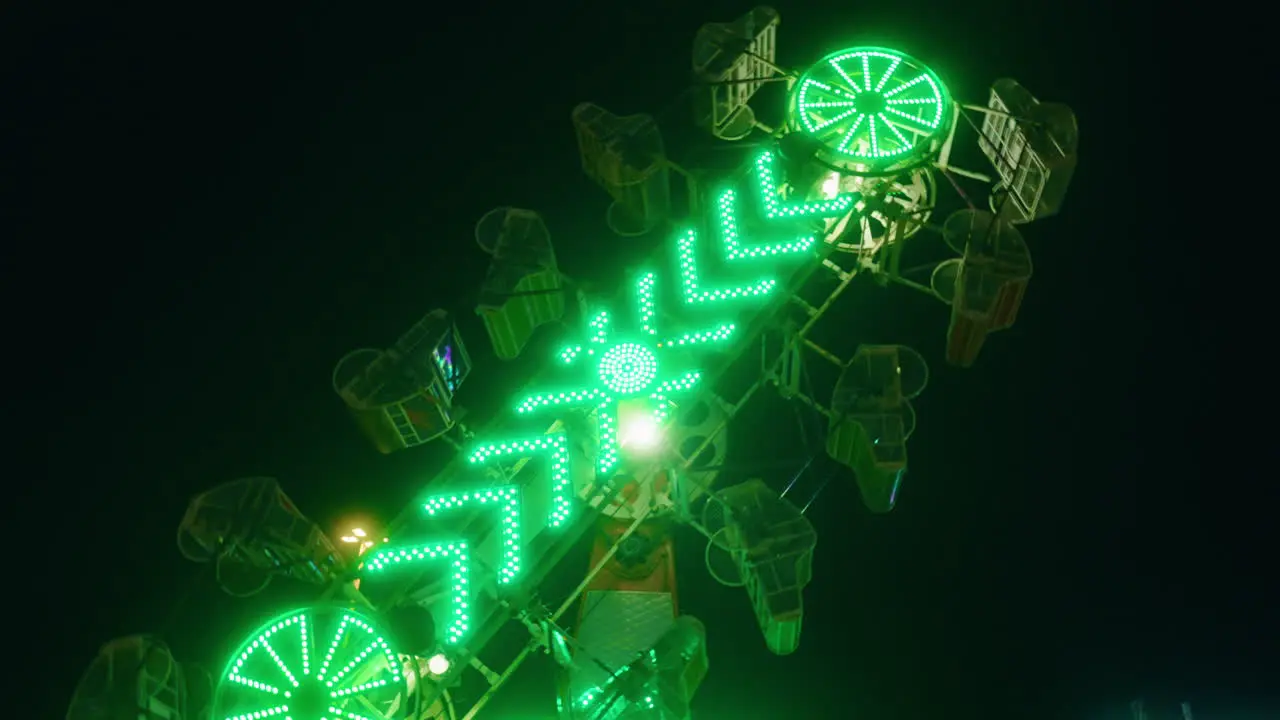 Night time view of The Zipper thrill ride at The Exhibition