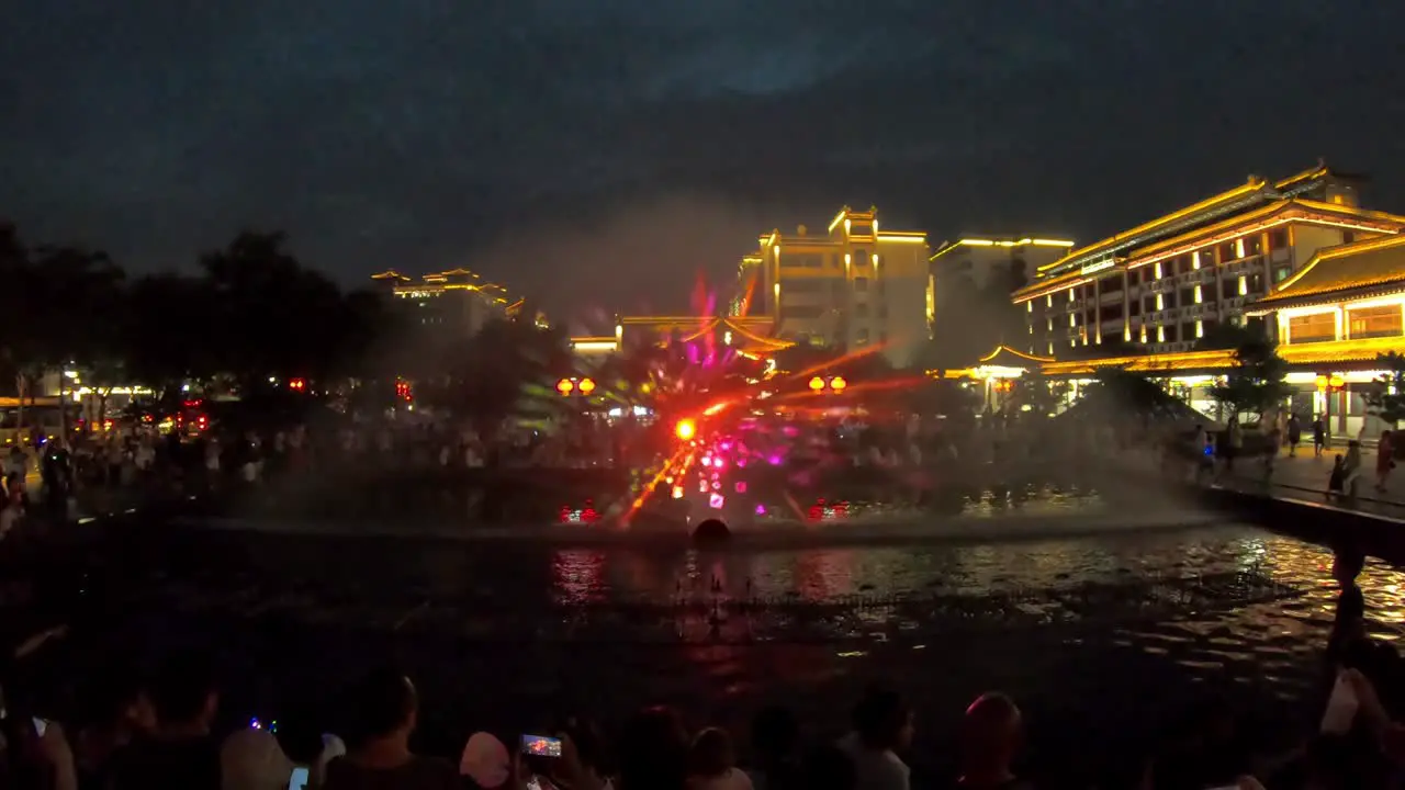 Amazing light and sound show in the fountains in the central town square at dusk in Xian China