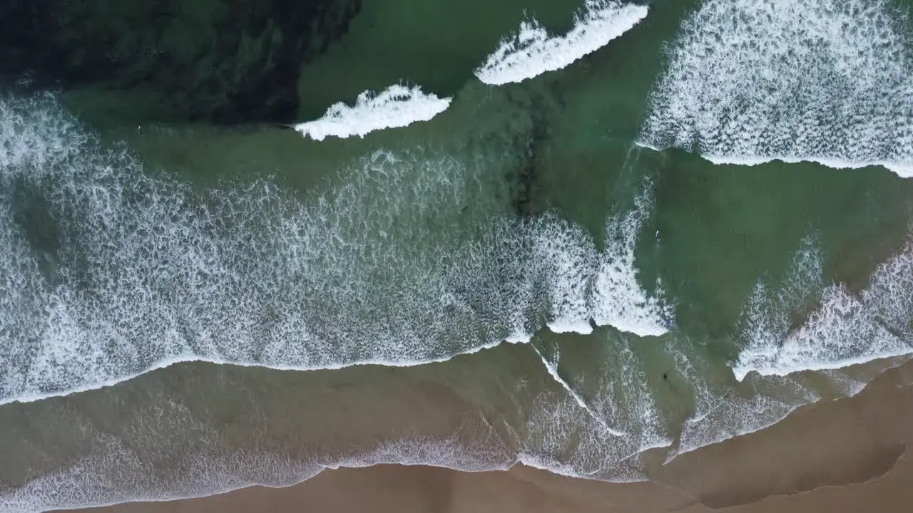 The waves on the beach of La Palue in Brittany in France filmed with the drone from above