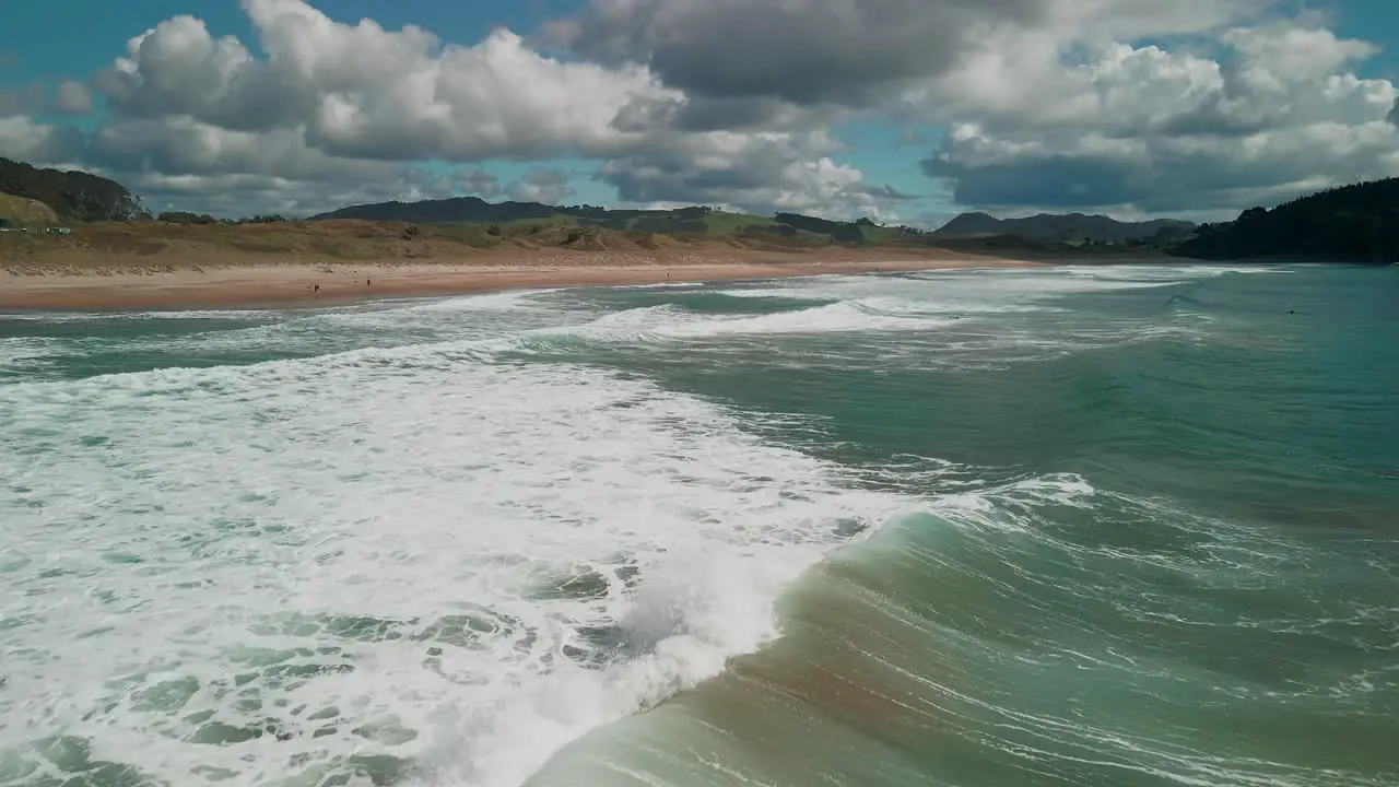 Flying drone above the wild East coast waves of New Zealand