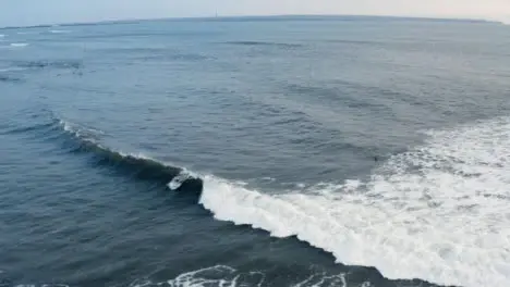 Drone Shot Following Wave Approaching Echo Beach 