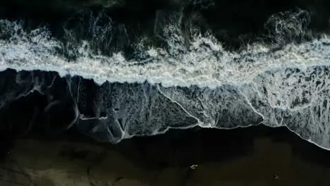 Drone Shot Ascending Above Waves at Pigstone Black Sand Beach