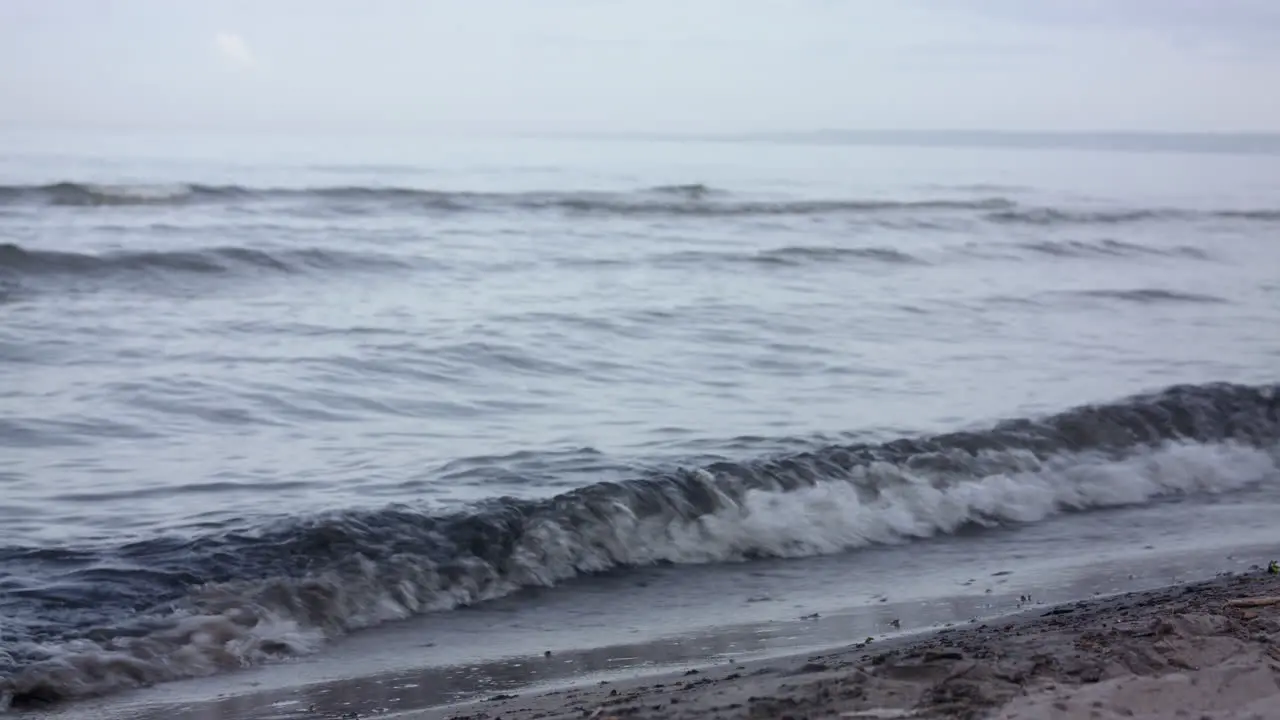 Waves crashing up on the shores on the beach