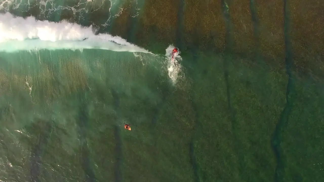 Flying Over Surfer Catching a Wave