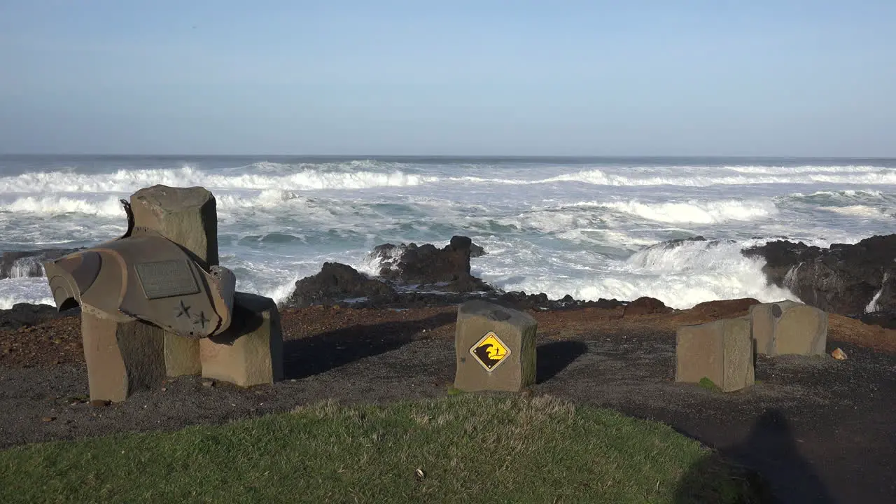 Oregon coast with monument and warning sign