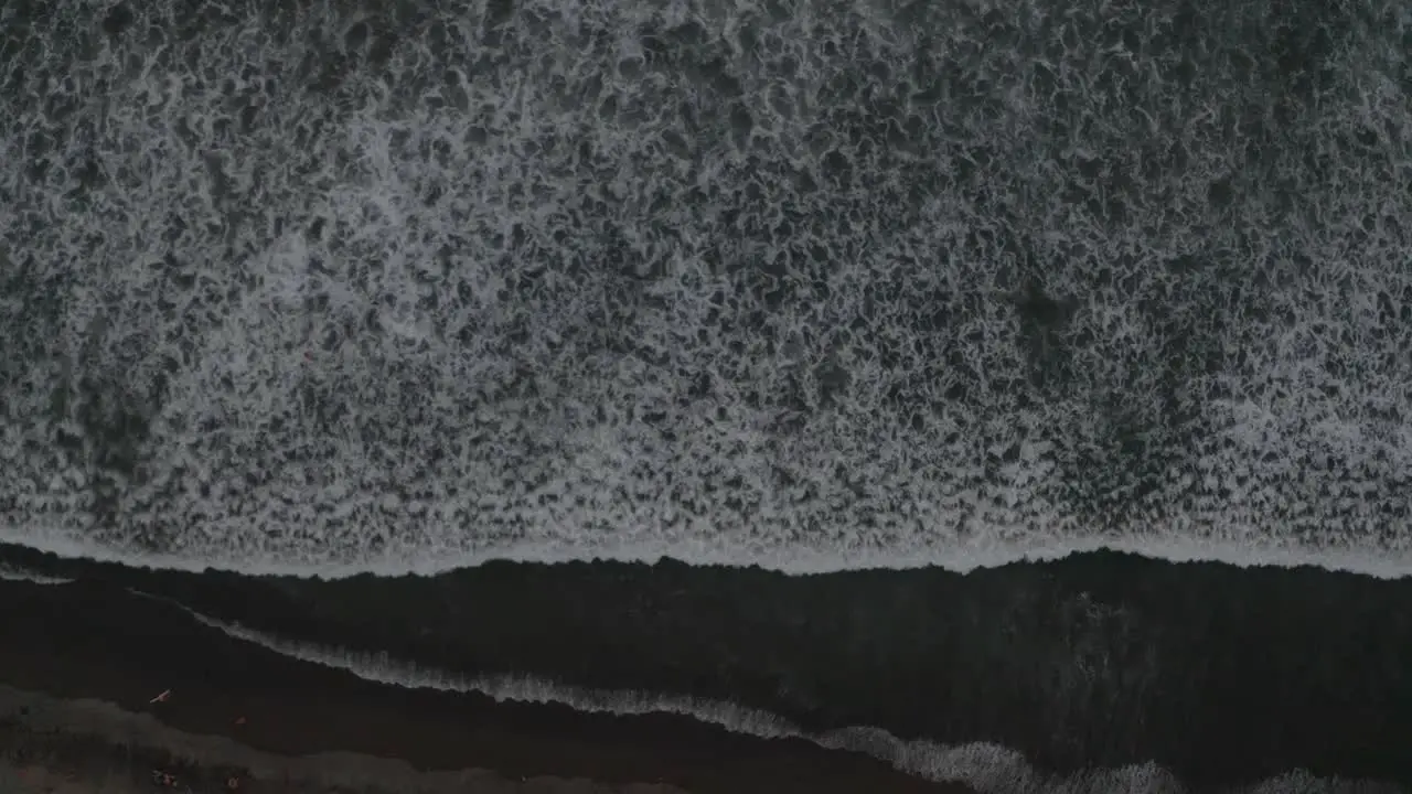 Aerial drone birds view shot of the ocean revealing the beach in Costa Rica 4k