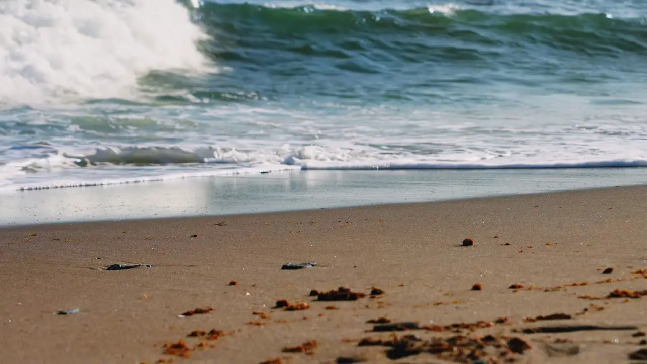 Waves crashing at a sandy beach