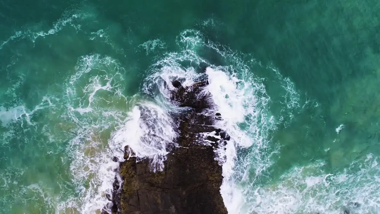 Ocean swirls crashing on rock