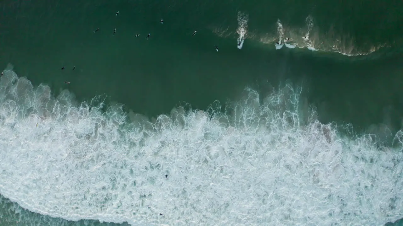 Aerial Surfers trying to catch a wave Llandudno South Africa