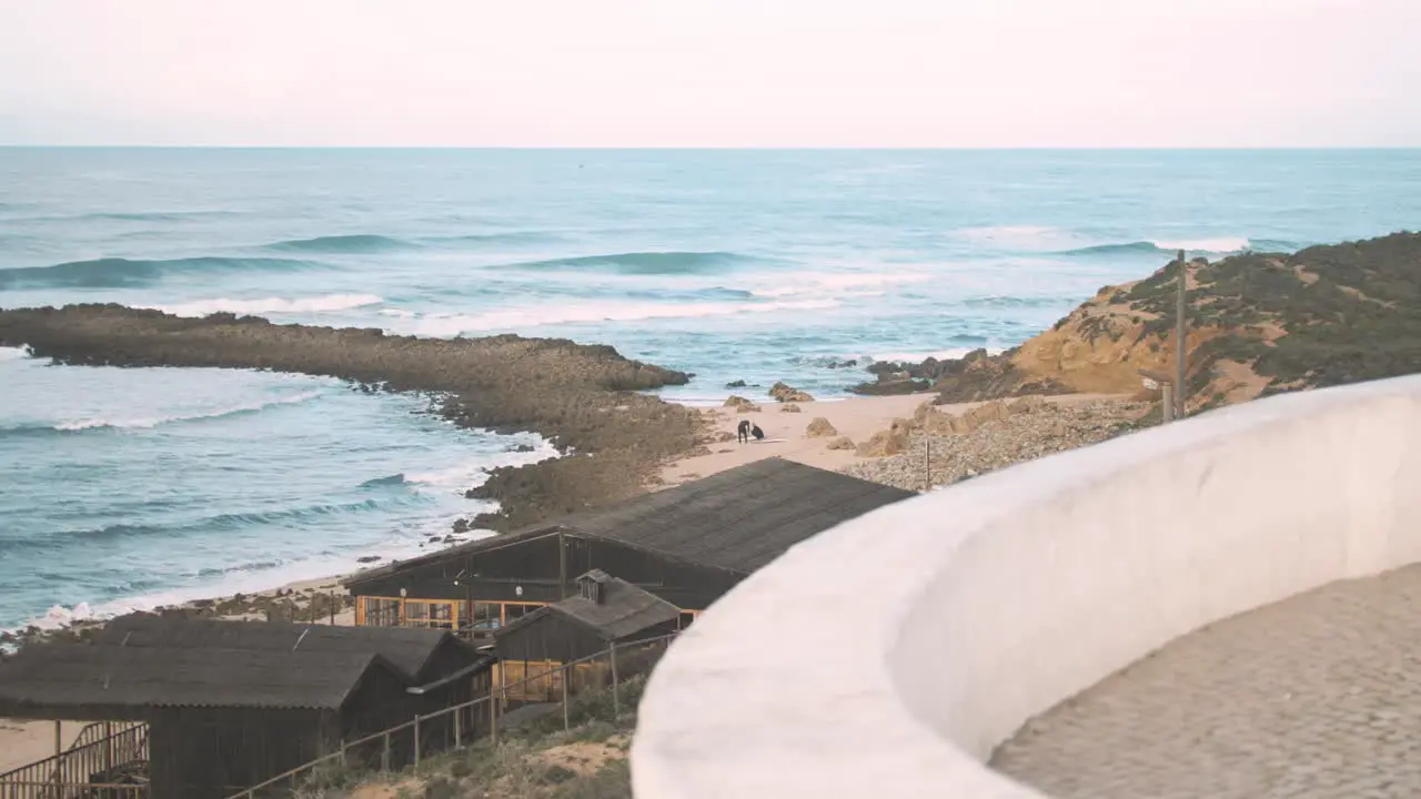 Surfers prepare to surf waves