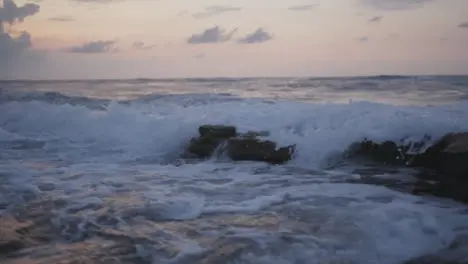 Tracking Shot of waves Crashing on Rocks in Bali