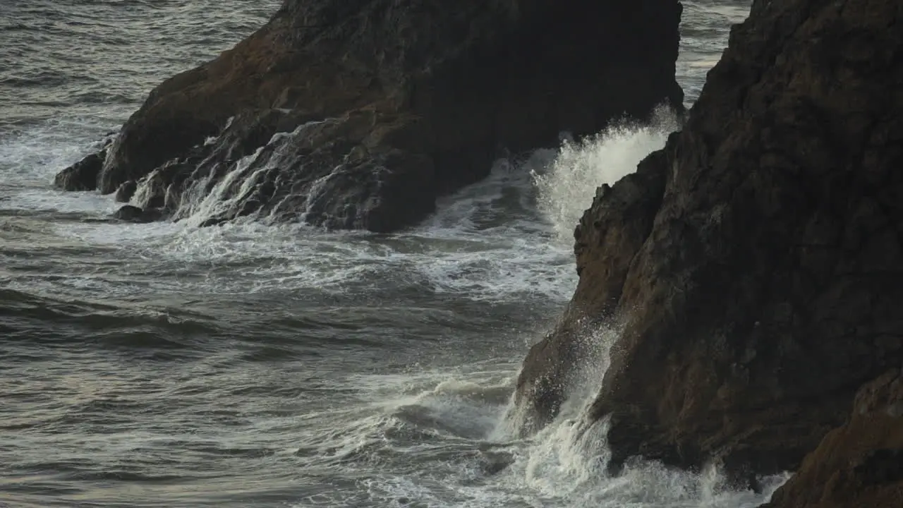 Pacific Ocean Waves Breaking Under Cliffs of American Coastline Slow Motion 120 fps