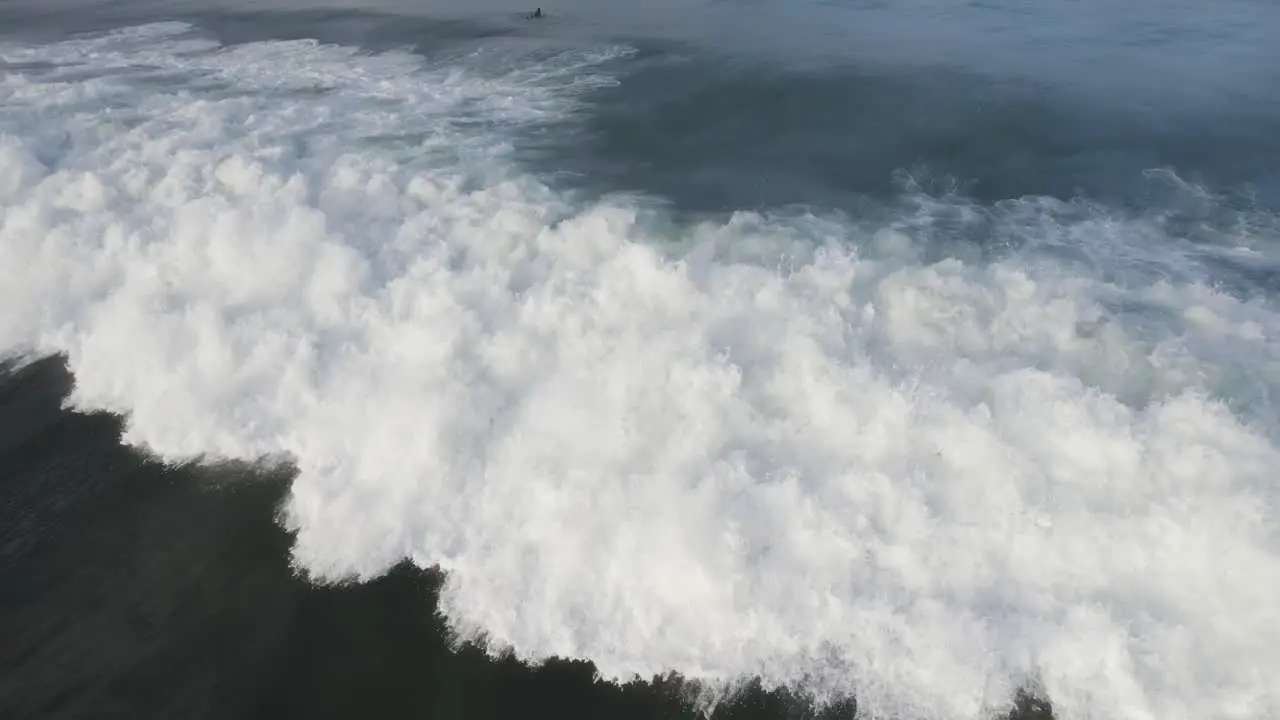 Close drone shot of a wave at Santa Teresa beach in Costa Rica