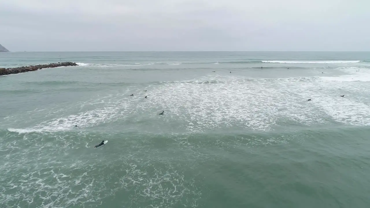 Aerial shot of surfers in Lima during wintertime