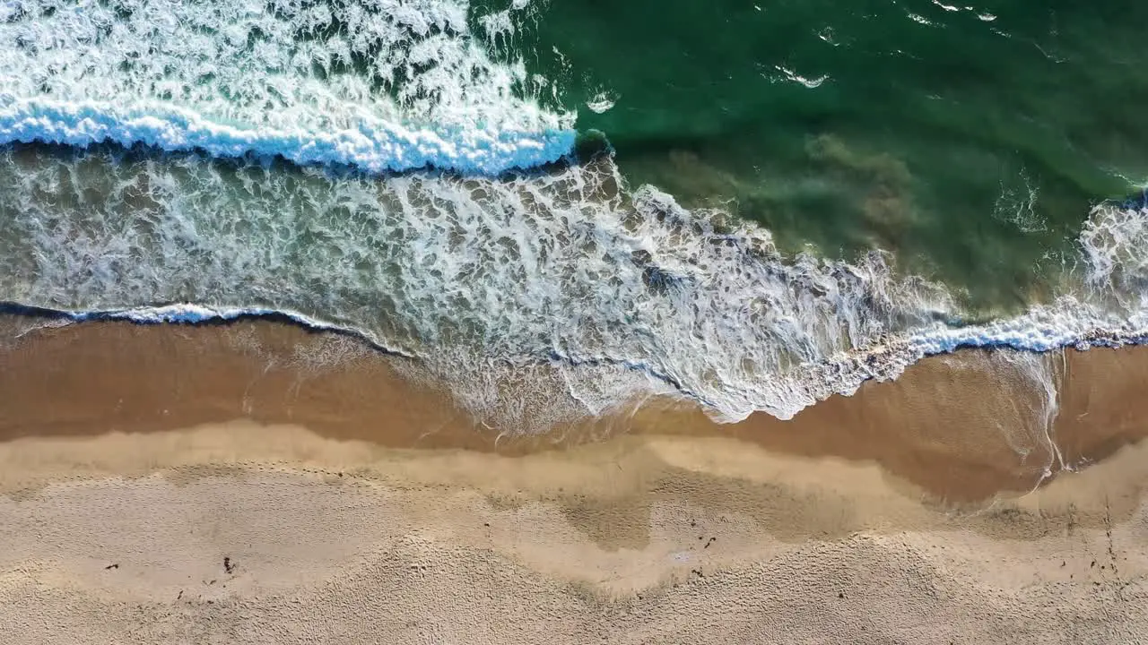 Frothy Waves Rolling On Sandy Shore During Summer In Manhattan Beach California USA