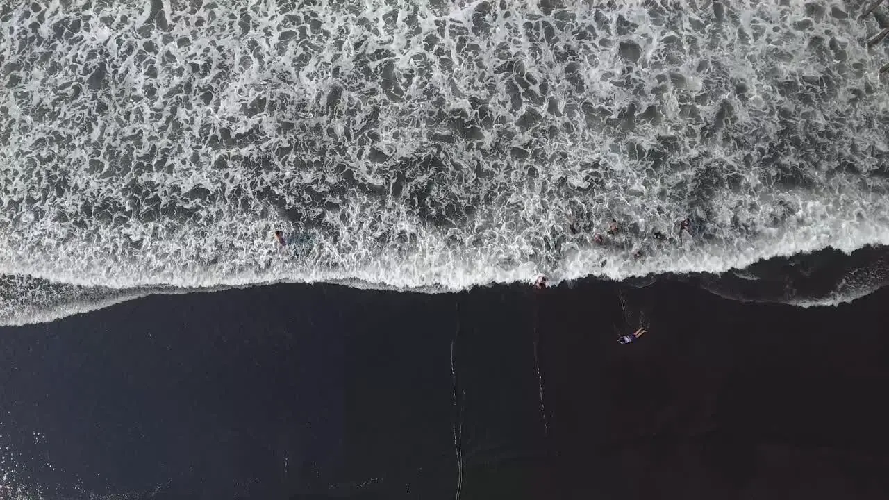 Beautiful aerial over a black sand beach 1