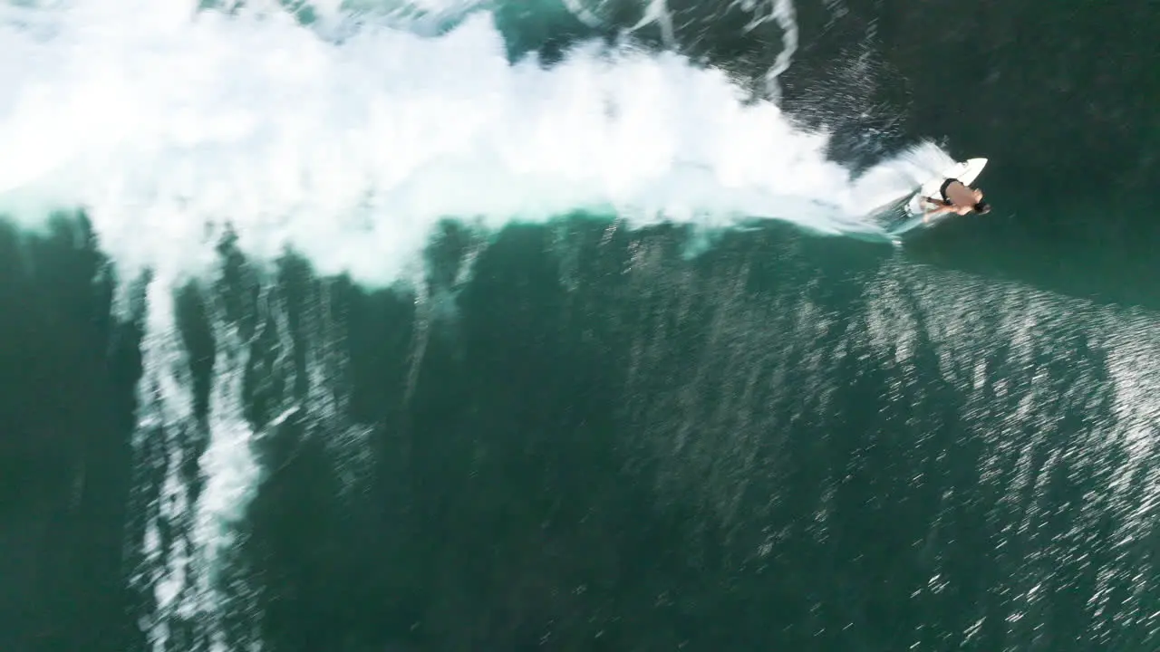 Surfer Catching a Big Wave at a Beach in Bali