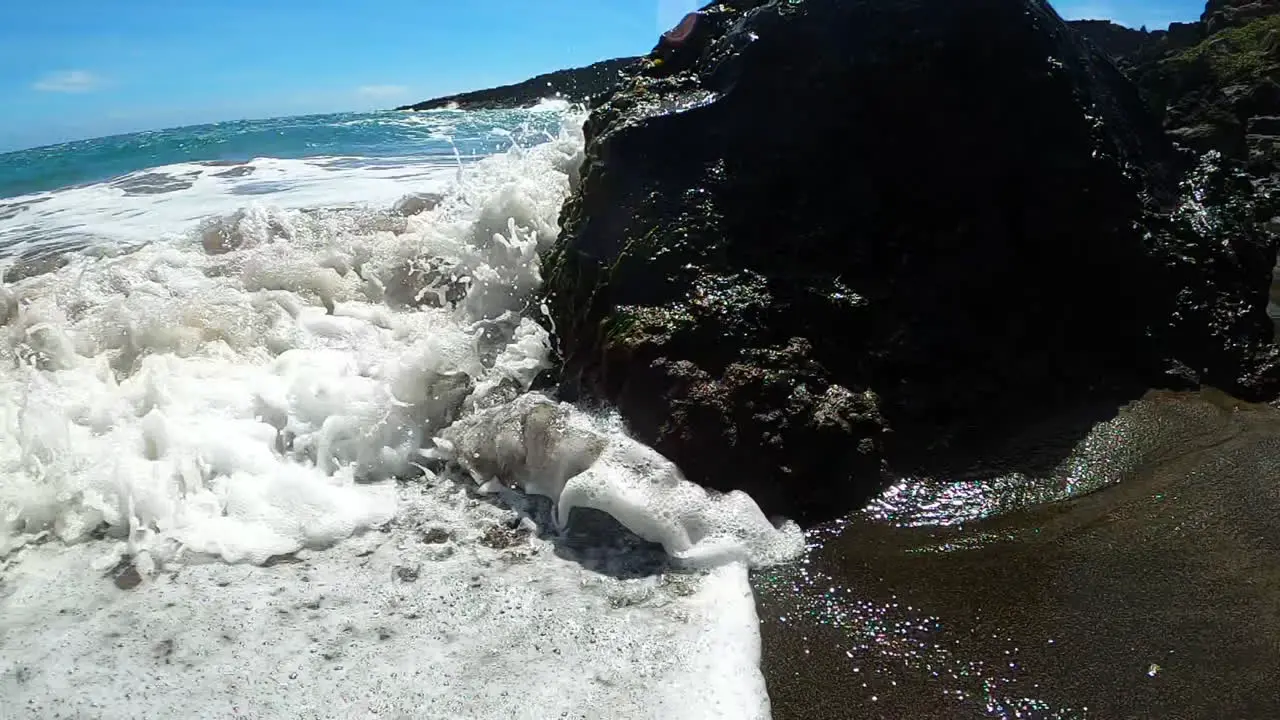 Wave Crashes Against Rock on Coastline of Green Sand Beach