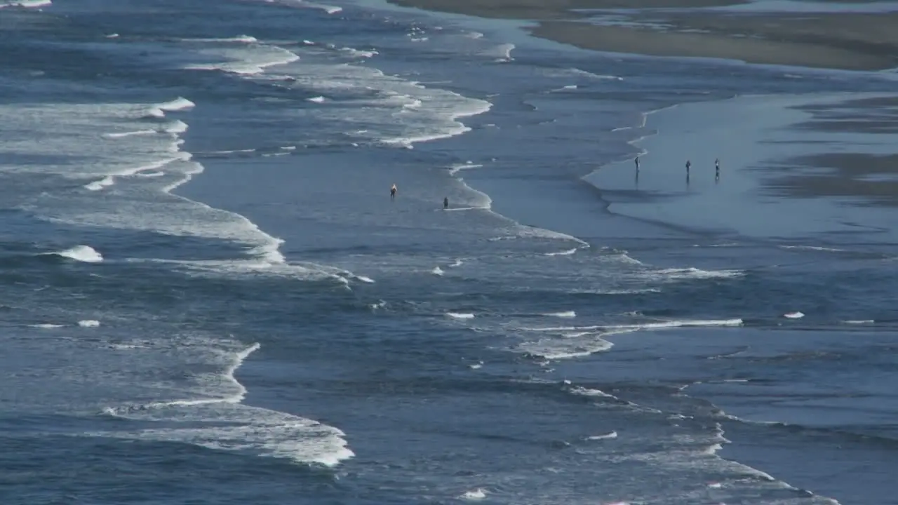 Ocean waves roll into a beach in Oregon or Northern California