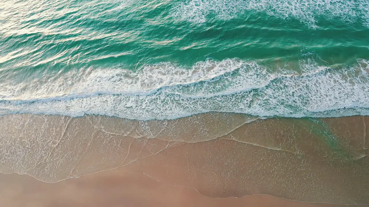 Top down drone view emerald color water beach Brazil