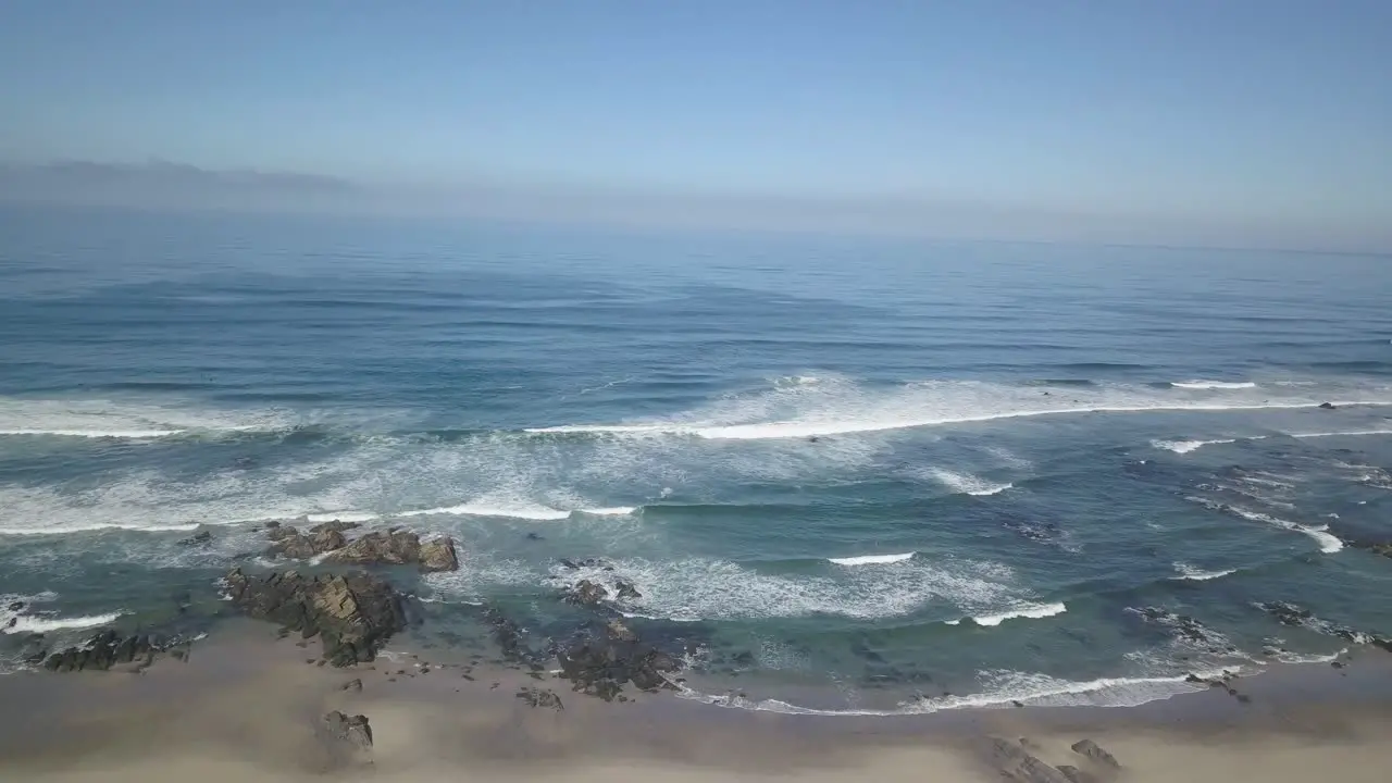 Relaxing aerial view drone birdeye waves breaking on coastal landscape atlantic ocean waves on beach shore beautiful wild nature shot