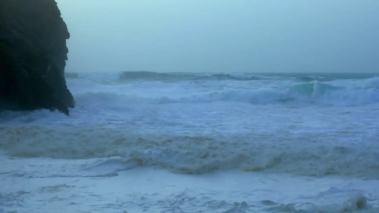 The violent waves in Chapel Porth beach UK during storm Ciara slow motion