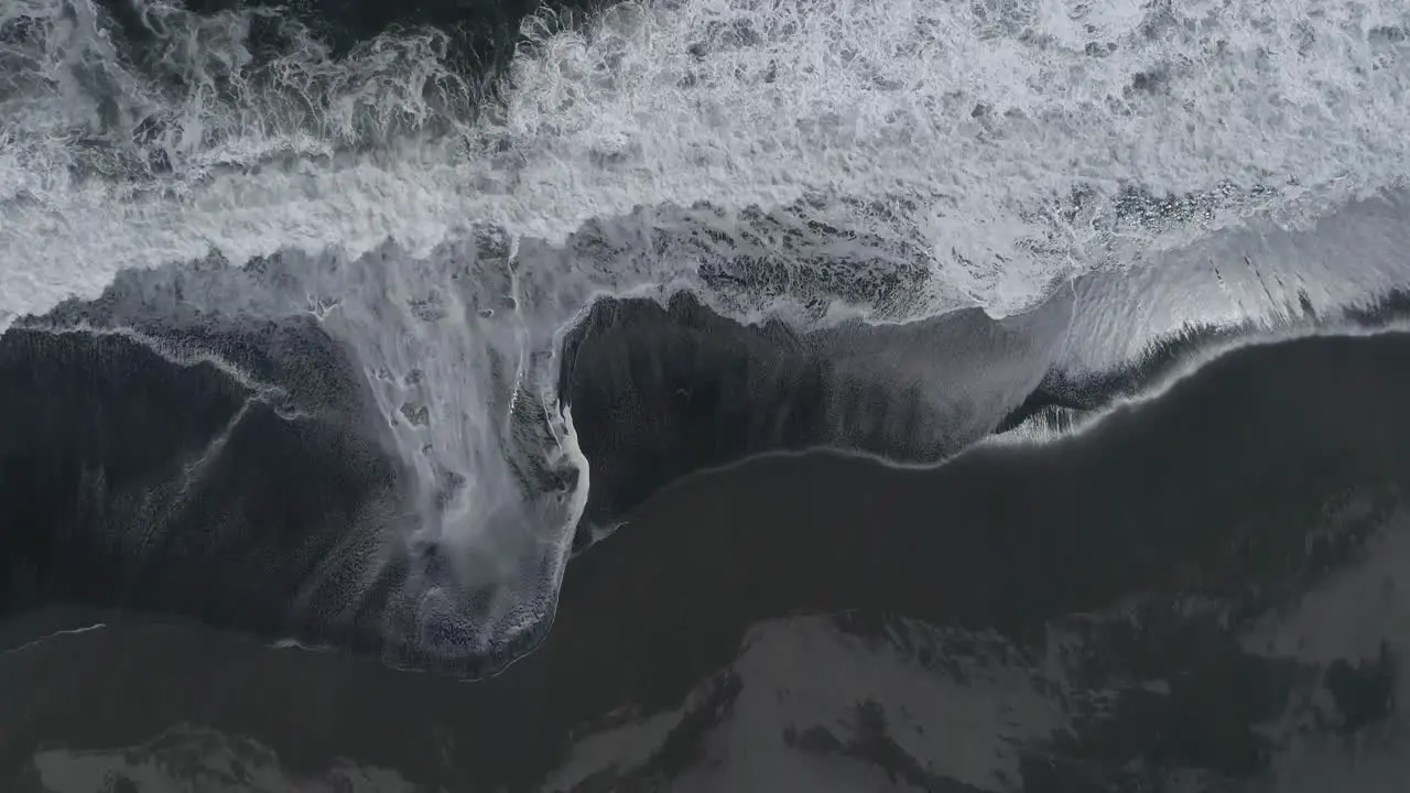 Rough Waves Washing Over Sandy Shoreline In South Chile