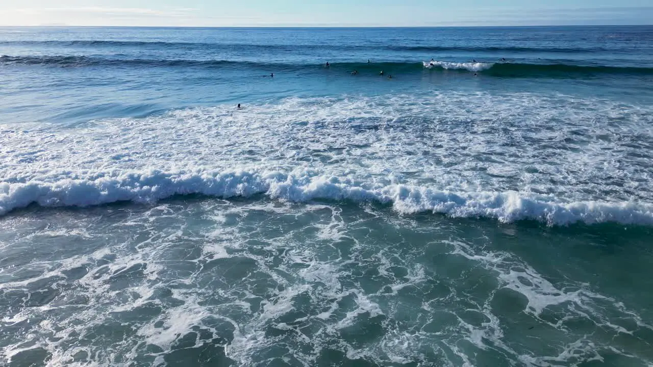 Foamy Waves Rolling With Surfers During Summer At Playa de Caion In Galicia Spain