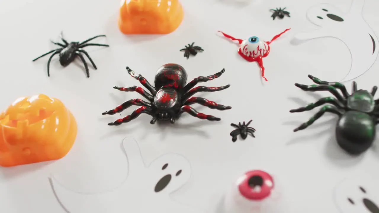 Close up view of multiple halloween toys against white background