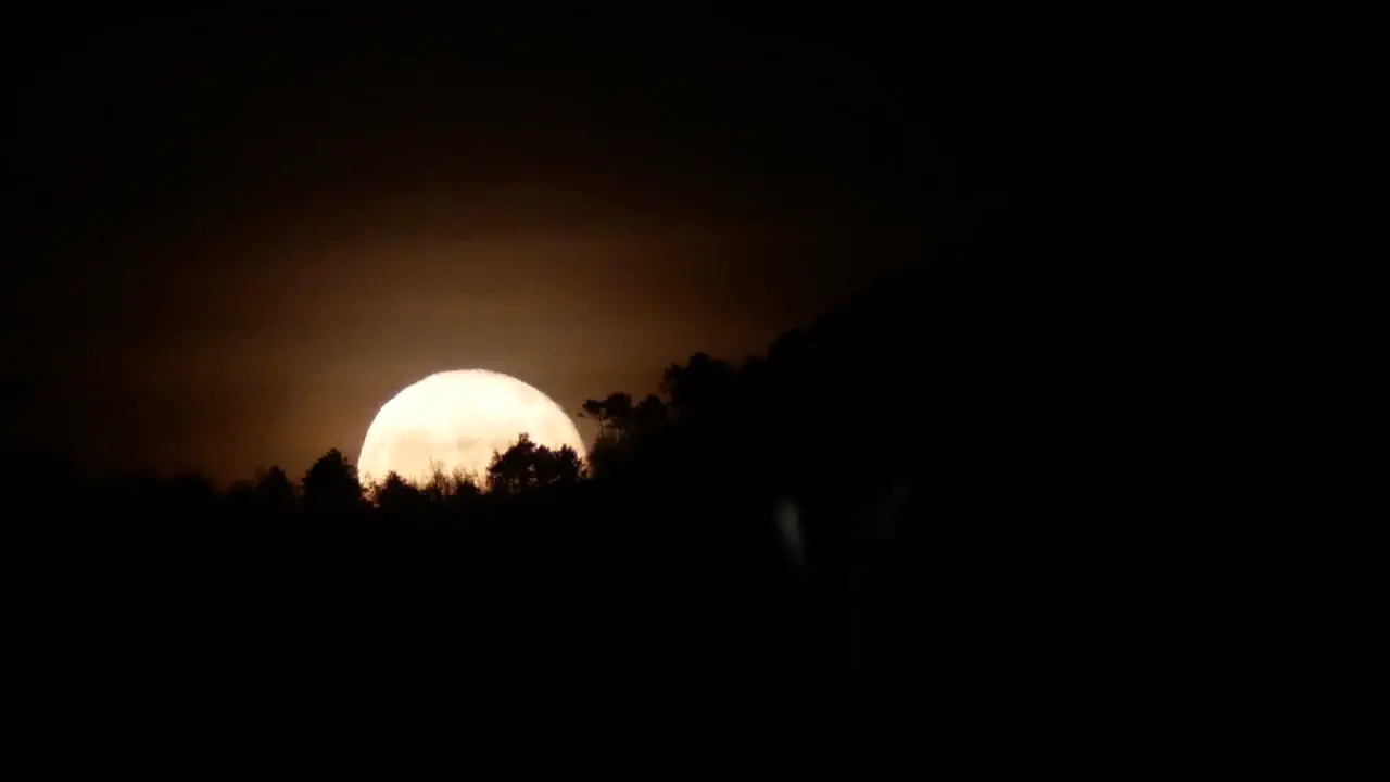 2017 July rising full moon on the countryside of Tuscany Italy