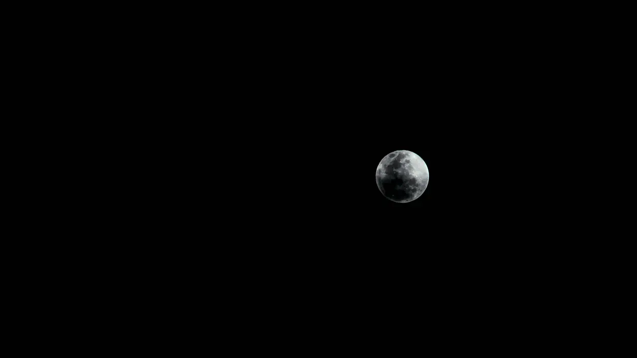 Night time lapse of clouds chasing the moon