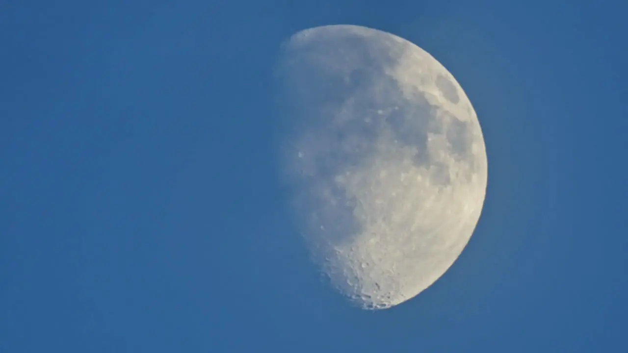 Slow moving moon against black sky