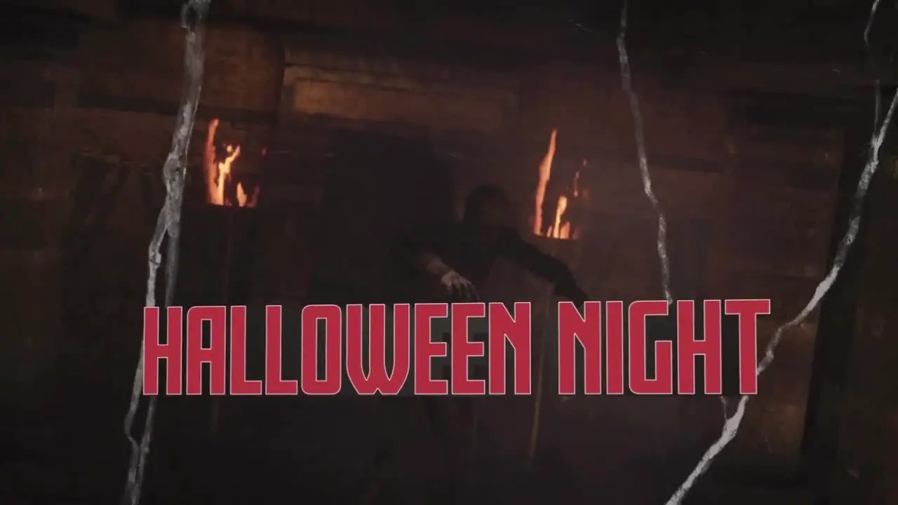 Animation of halloween night text over zombie walking