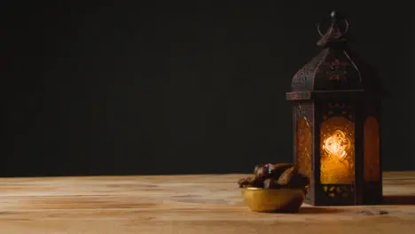 Tracking Shot of Hand Taking a Drink of Water On a Table for Ramadan