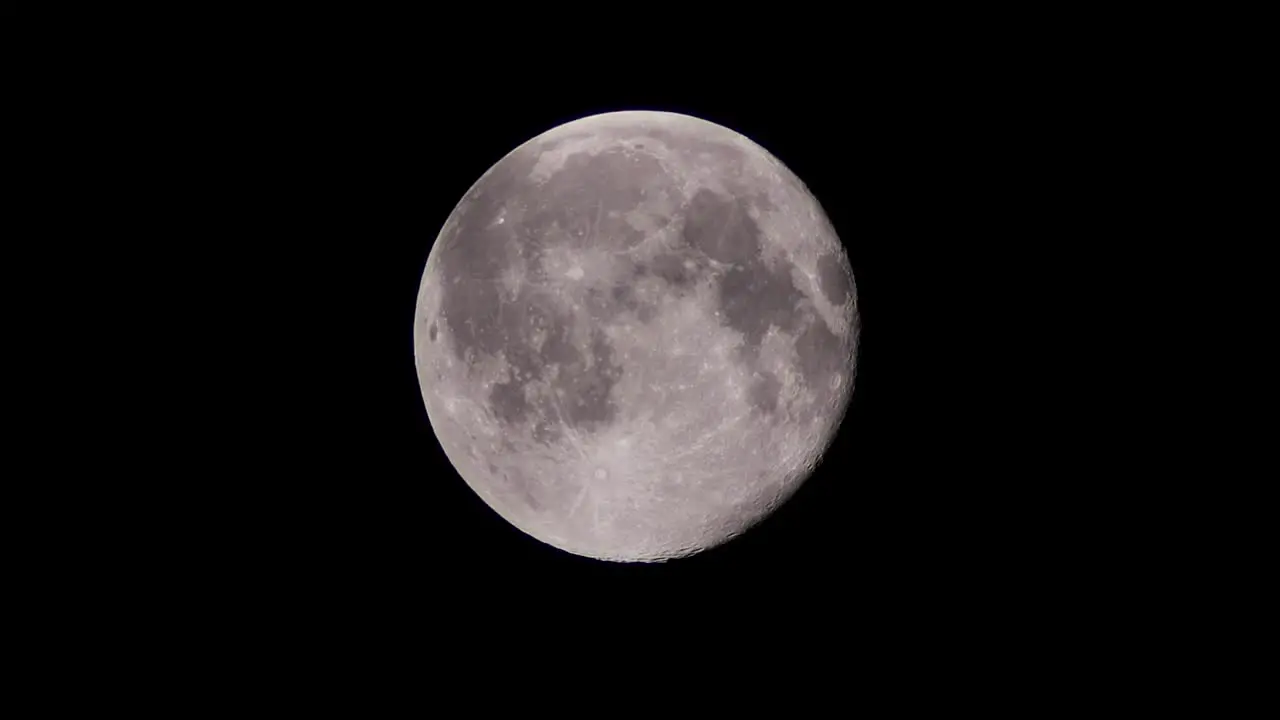 Full super winter moon in cloudy night sky