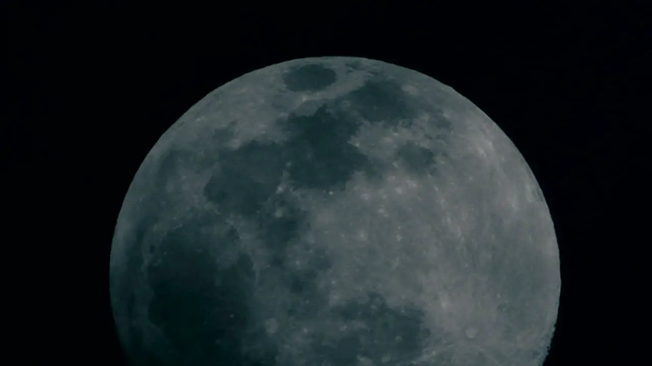 Clouds Passing At Full Moon Rising At The Night Sky