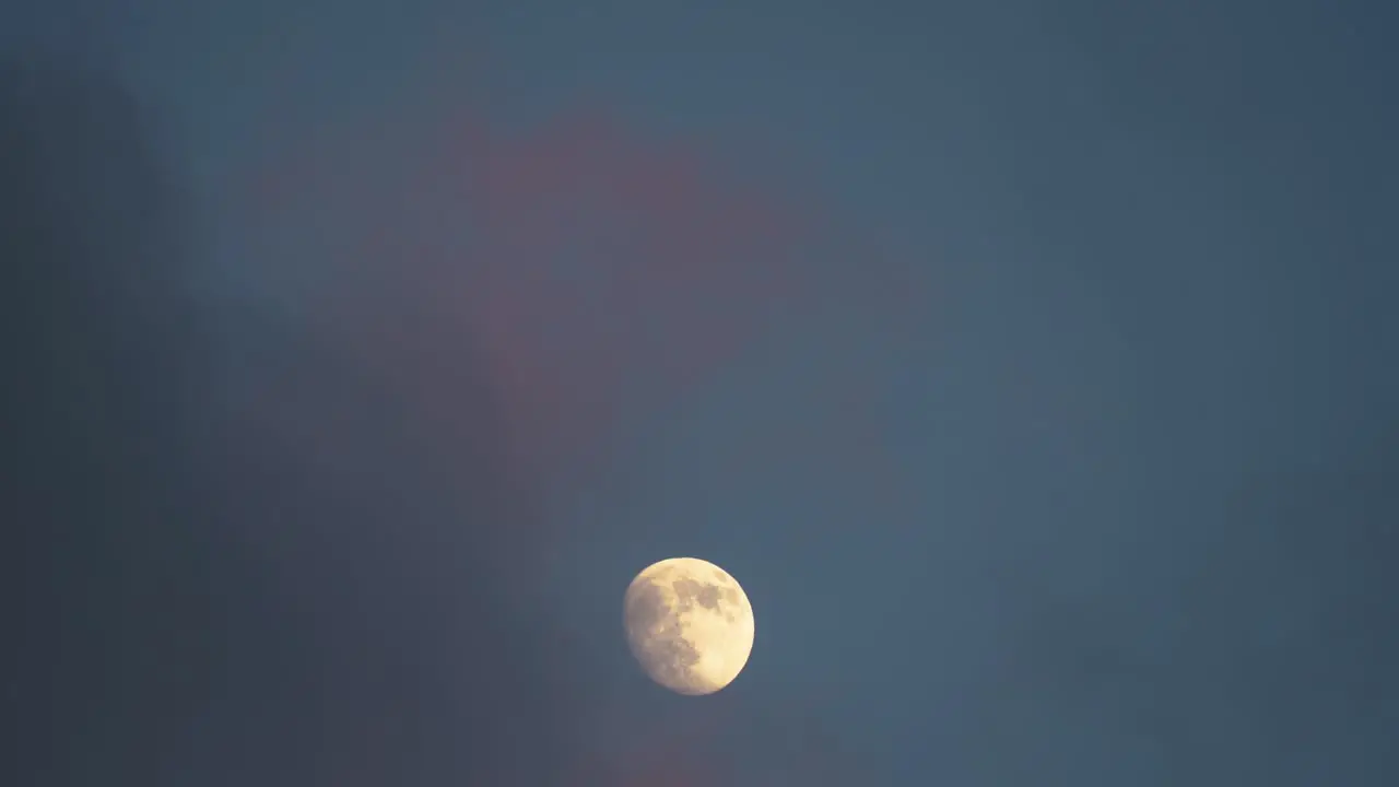 Clouds Reveal Moon at Dusk Telephoto View