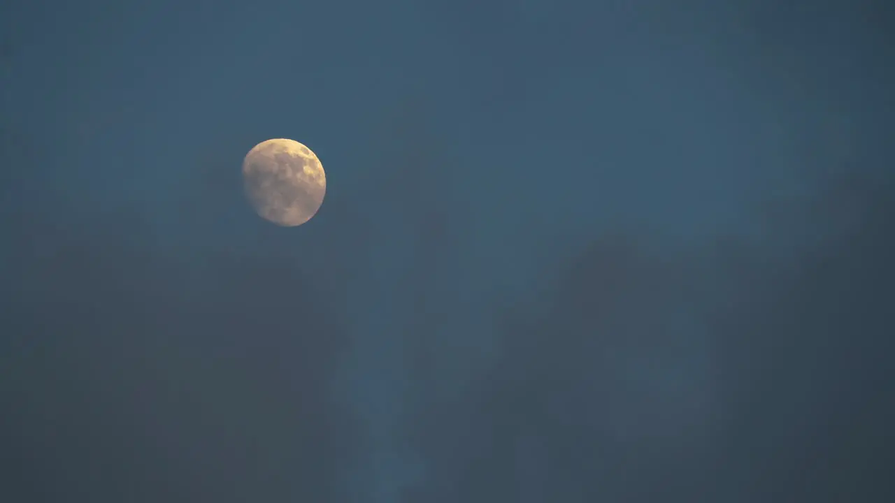 Big Yellow Moon in Cloudy Blue Evening Sky