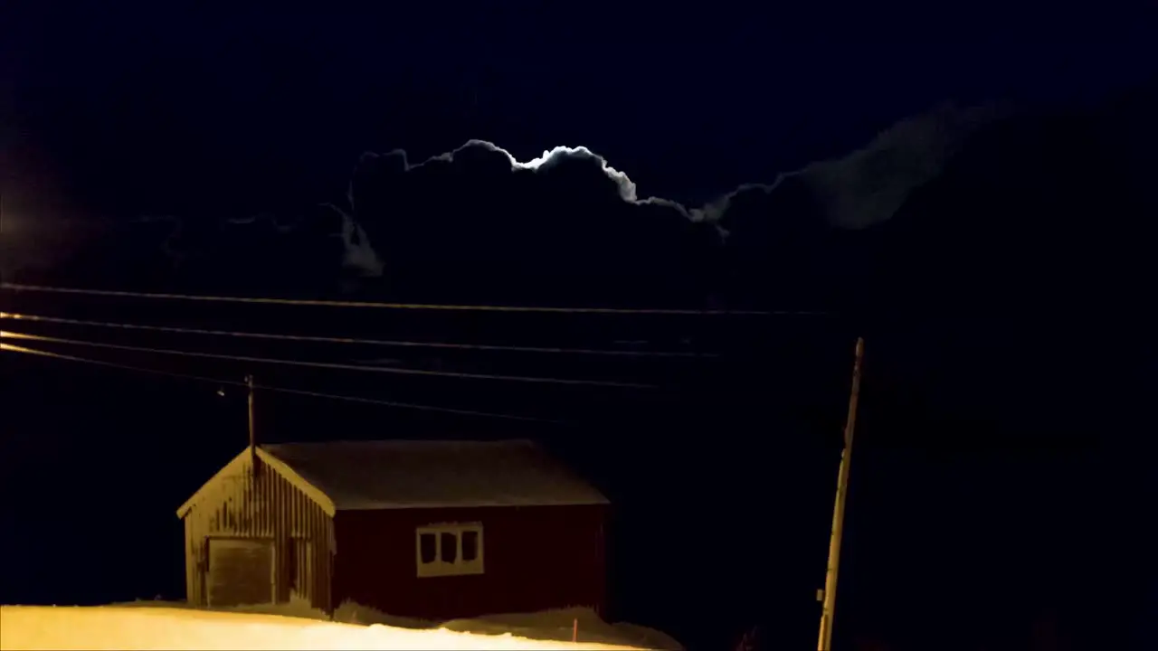 Time lapse of the Moon shining brightly after the clouds covered it in Lapland Finland