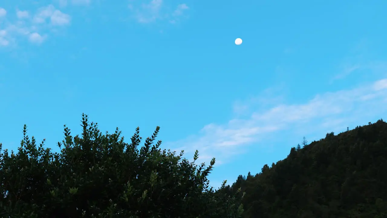 Mystical twilight Moon graces the sunset sky in captivating stock footage