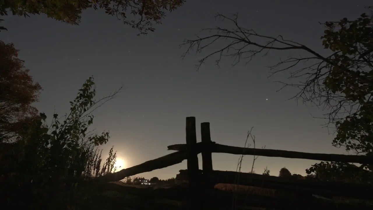 Time Lapse Of Beautiful Moon Rise Full Moon Over Old Farm Fence