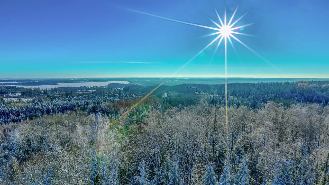 Bright full moon crossing a wide winter landscape time lapse