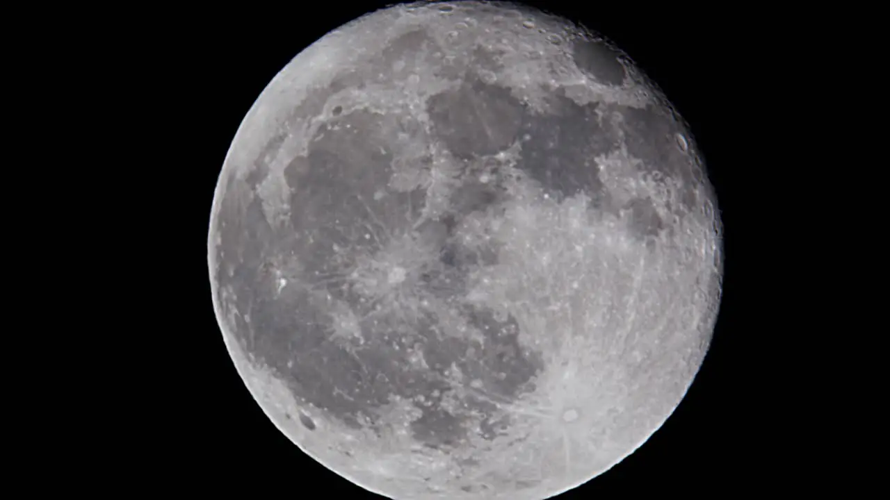 Detailed full moon against dark black night sky